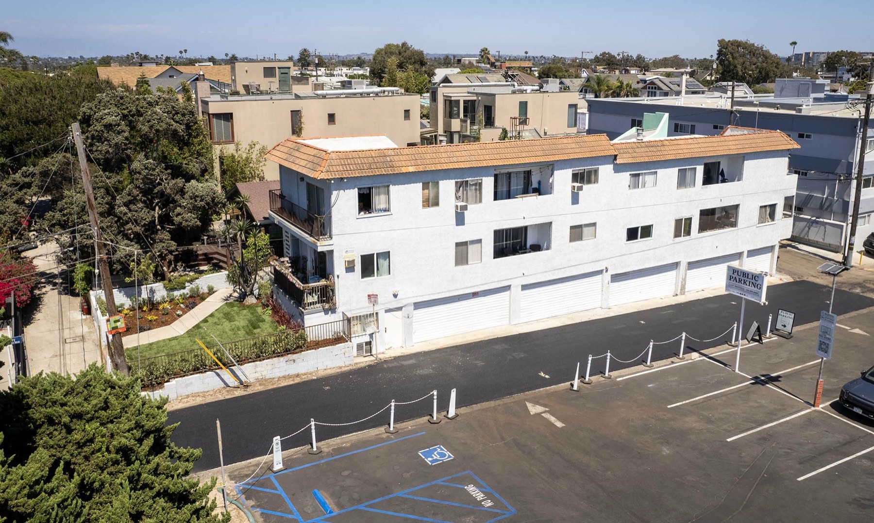 Aerial view of building and garages