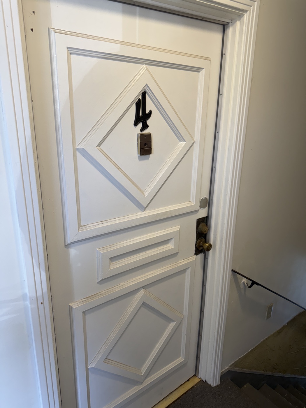 Original diamond-paneled unit door detail