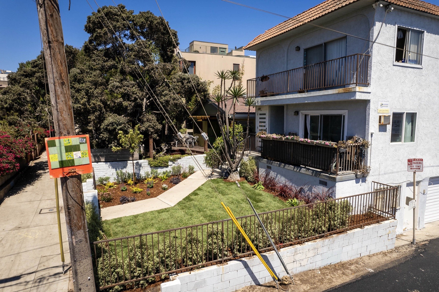 Street-level view with landscaped frontage
